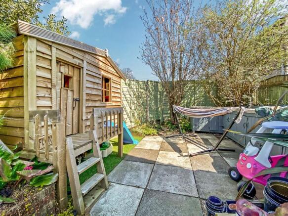 Patio to rear garden & Wendy House