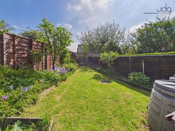 Private, well-established garden with lawn, patio seating and space to grow
