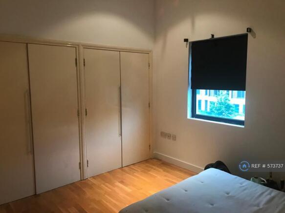 Bedroom Showing Fitted Cupboards