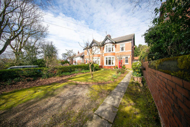 Front elevation, garden & driveway
