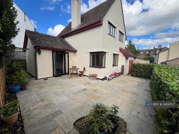 View Towards House With Patio Garden In Foreground