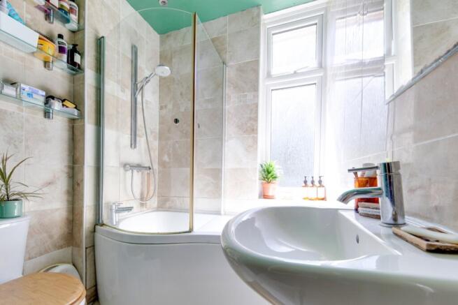 Family bathroom with airing cupboard and P bath sh