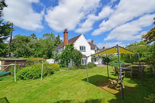 Meadow Cottage, front & garden with roses.jpg