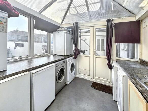 Bright laundry room with ample appliance space...