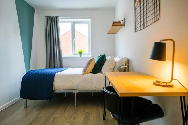 A bright and modern living room featuring a com...