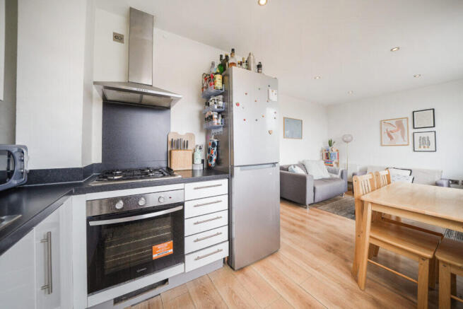 Modern kitchen with stainless steel appliances, in