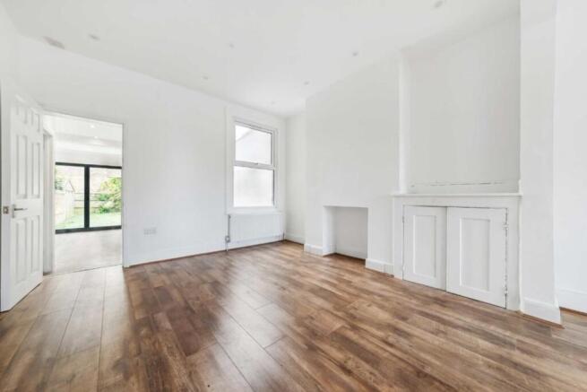 Bright living room with stunning wood floors...