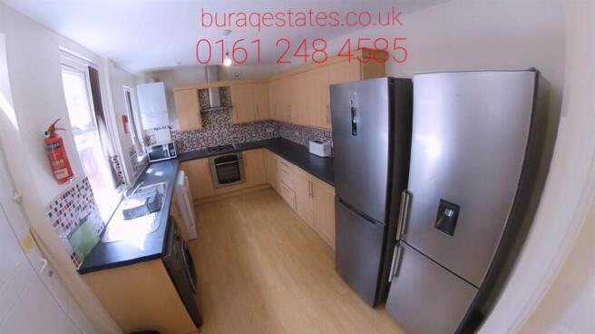 Bright kitchen with dual fridge freezers...