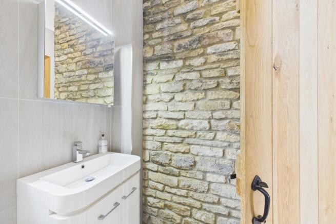 Beautiful exposed brick wall in bedroom 2 ensuite