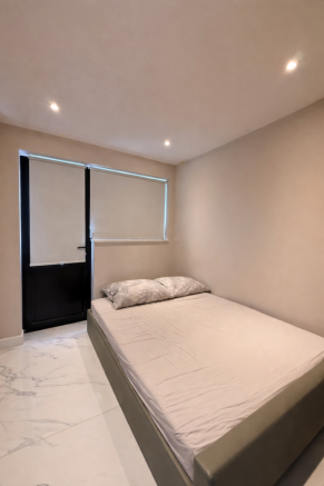 Minimalist bedroom with simple bed