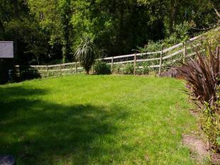 TO THE REAR OF THE PROPERTY