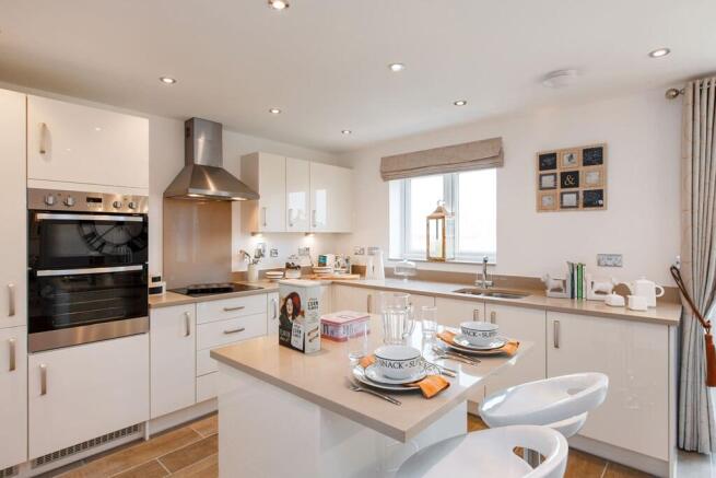The kitchen is fitted with a Silestone worktop and upgraded appliances