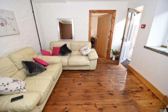 Bright, cosy living room with comfortable cream...