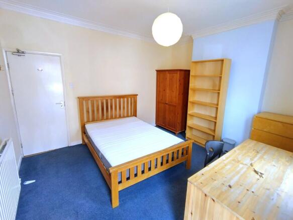Bright double bedroom with ample storage space...