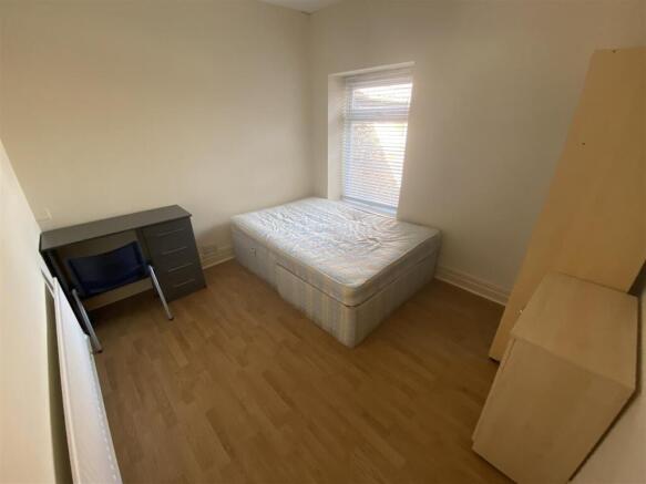 Bright bedroom with double bed and study desk...