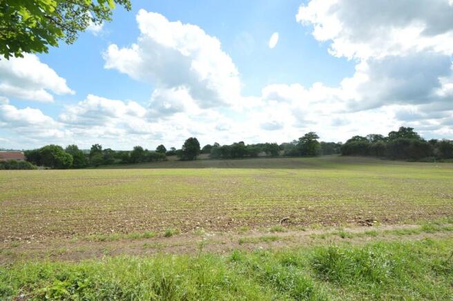Farmland to rear