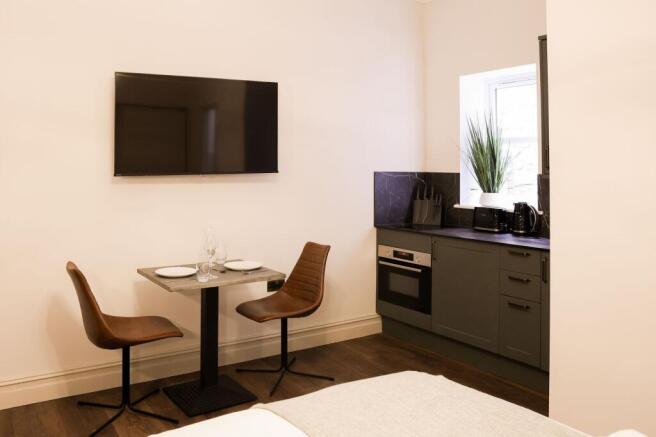 Stylish kitchenette with modern dining area...