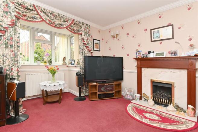 Sitting Room - fireplace and bay window.jpg