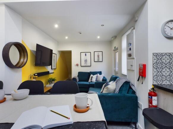 A spacious and inviting modern living room, per...