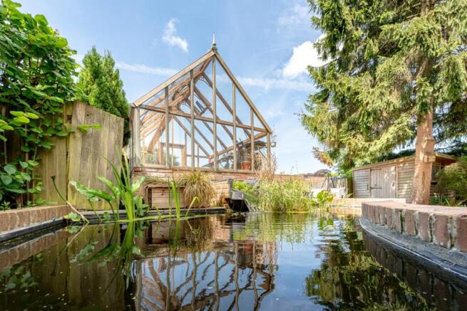 Pond and green house