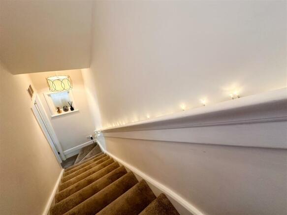STAIRS RISING TO THE FIRST FLOOR