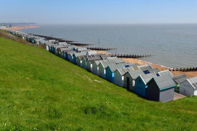 Colourful beach huts overlooking the Suffolk coast