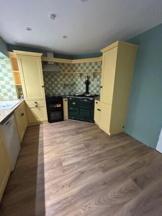 Kitchen area with aga and oven
