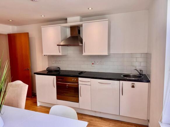 Bright kitchen with modern white cabinetry...