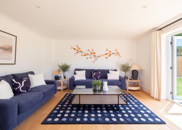 The sitting room opens to the garden