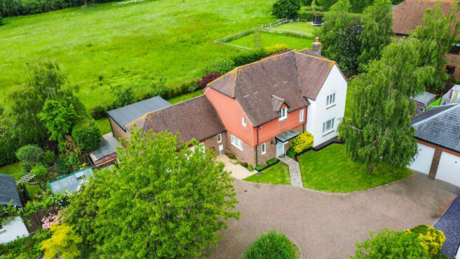 Elevated view of the house with the field behind