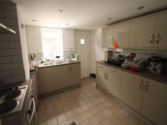 Bright kitchen with ample countertop space and ...