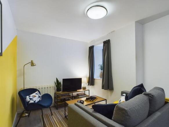 Bright, modern living room with comfortable sof...