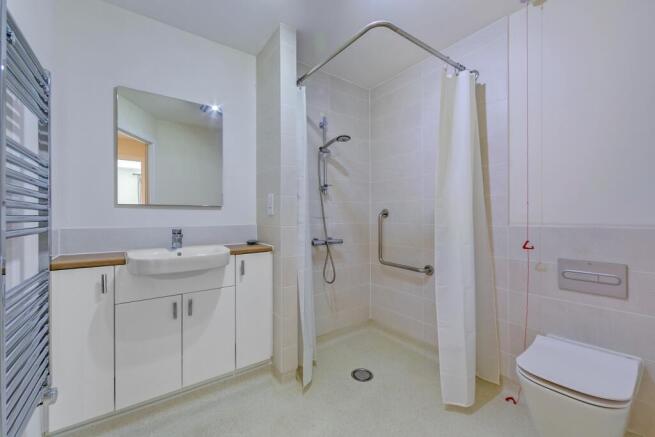 a bathroom with a shower and sink