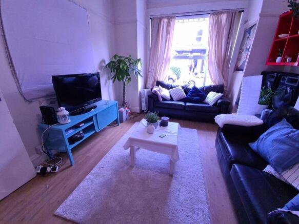 Bright and inviting living room featuring a lar...