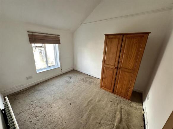 Bright bedroom with classic wood wardrobe...
