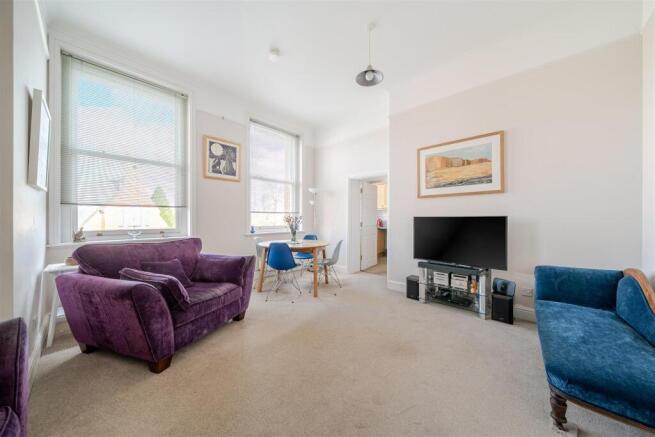 Sitting Room with large windows allowing ample lig
