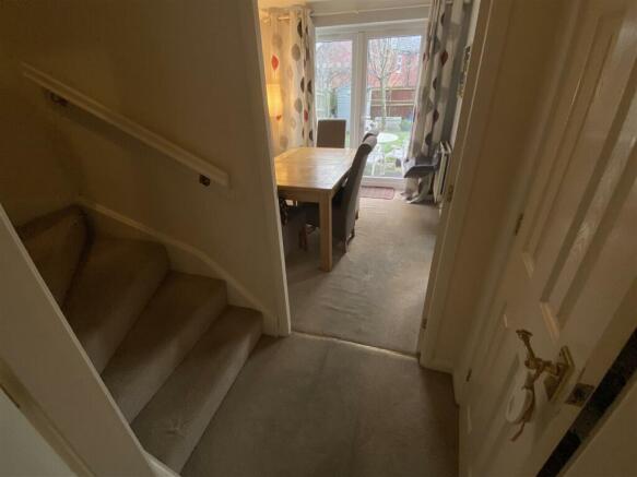 Inner hallway with stairs and accessDining off and