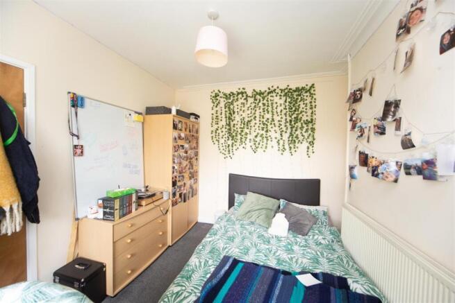 Bright and cozy bedroom with personal touches...