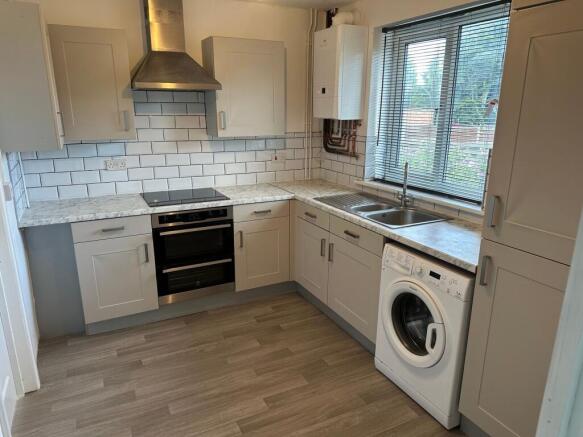 Modern kitchen with integrated appliances...