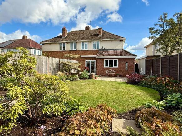 Bak garden and rear view of house