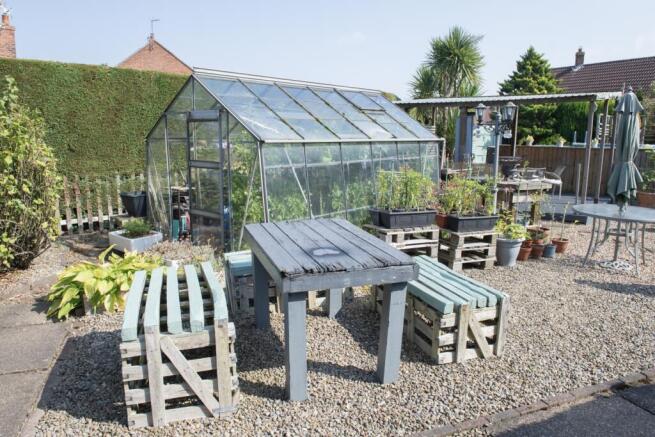 Rear Garden And Greenhouse