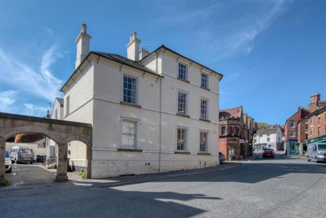 Building and archway to car park.jpg