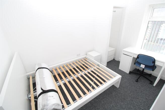 Bright modern bedroom with dedicated desk space...