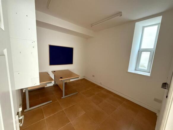Bright study area with desks and natural light...