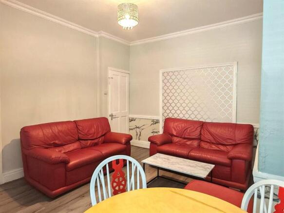 Social living space with comfy red leather sofa...