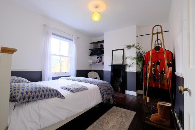 Bedroom 1 with fireplace and sash window