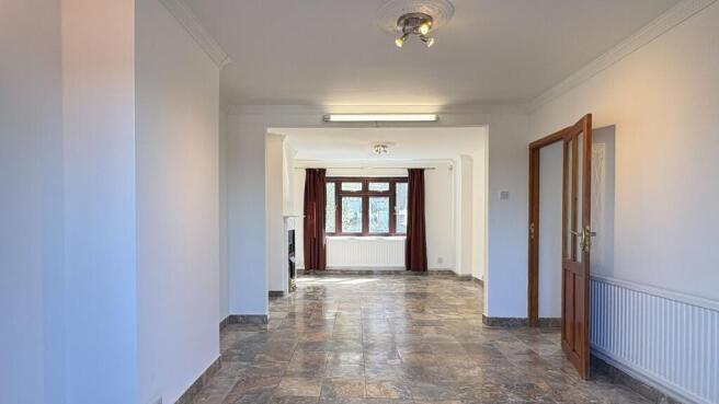 Bright expansive lounge with stylish tiled floo...