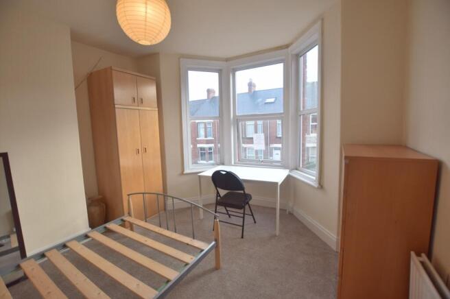 Bright and inviting double bedroom featuring am...