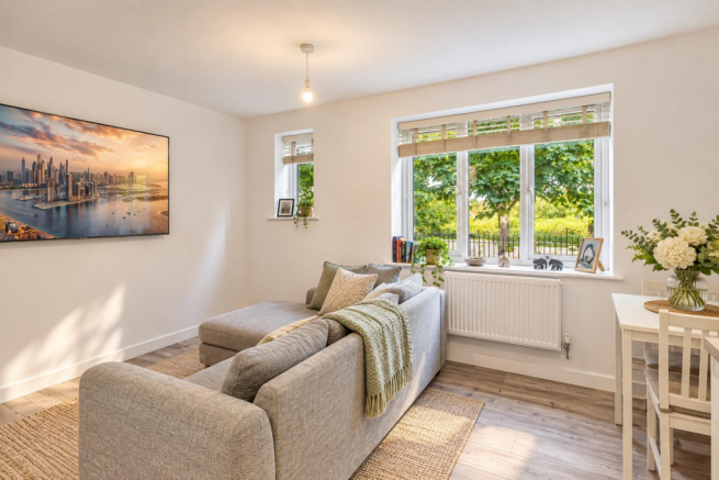 Bright Scandinavian Living Room with Greenery.png