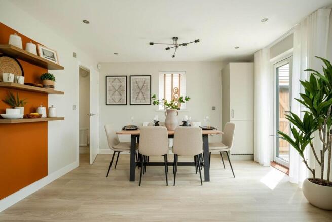 The kitchen/dining area boasts double doors out to the garden
